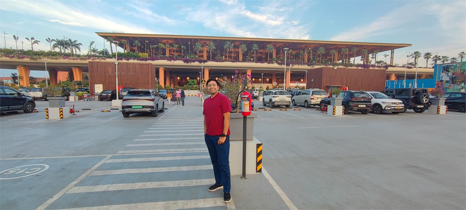 Abhishek outside a building at dusk